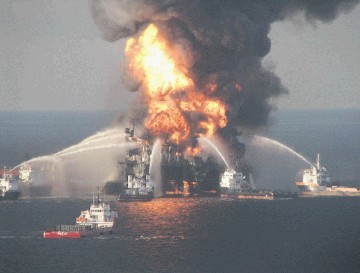 Coastguard and fire boats spray water on the blazing remnants of BP’s Deepwater Horizon rig after the 2010 explosion