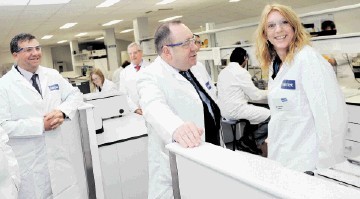 RED LETTER DAY: Alex Salmond, centre,  speaks to Heike Hoffmann about her work as Intertek operations manager Doug Finnie looks on.       Kami Thomson