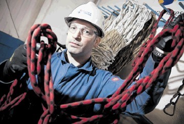 ROPED IN: ATS rope access instructor Jason Sim inspecting the ropes