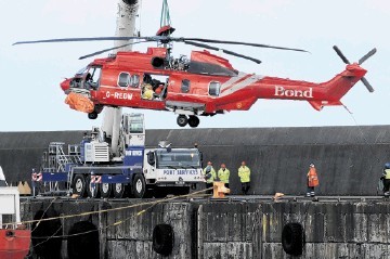 DITCHED: The Bond G-REDW being lifted off the Seven Pelican at Peterhead harbour. Kenny Elrick