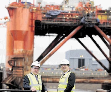 FORTUNES REVIVED: Energy Minister Fergus Ewing, left, and Roy MacGregor of Global at the yard. Sandy McCook