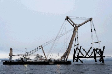 HEAVY LIFT: North Sea Frigg platform being decommissioned having been chopped up using CUT slicing systems