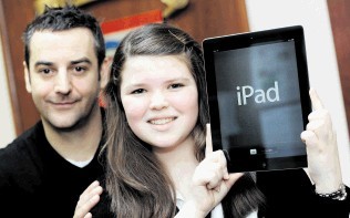 Shell Social Performance advisor John Raine presents competition winner Kirsty Taylor with her prize of an iPad for Hazelhead Academy