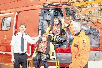 PILOTS OF THE FUTURE? From left, Bond pilot Tim Milward, Robert Gordon’s College pupils  Jenna Rothwell and Henry Sorrell, and  Brian Sandberg, head of training for NHS (Norsk Helikopter Service)