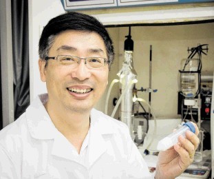 REMARKABLE: Prof Darren Sun of NTU, Singapore, with a sample of a  titanium dioxide nano-technology product