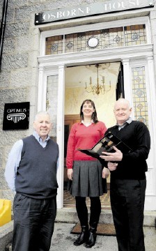 IMPROVING BUSINESS: Peter Stock, Catriona Wilson and Sean Gallagher at the Optimus offices on Carden Place, Aberdeen. Kevin Emslie