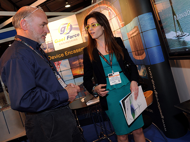 David Guthrie talks with a customer at the Gael Force stand at All-Energy 2012