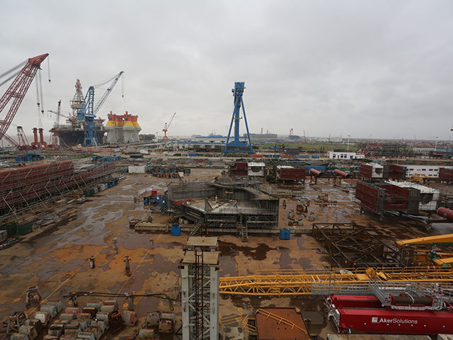 Centre of picture - Cosco Hull No. N487 - Hull blocks (keel to 5.5m level) located on COSCO QiDong #1 skid-way during assembly. Bottom left-hand corner of pic - next sequential hull block in readiness for lifting on to skid-way