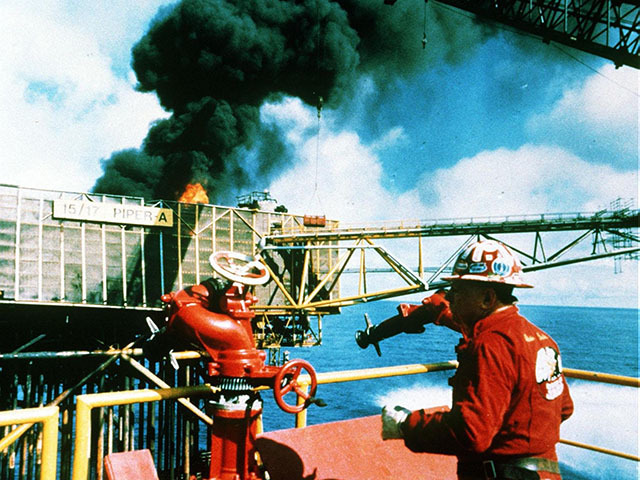 Texan expert fire fighter Red Adair on the still-burning Piper Alpha offshore platform.