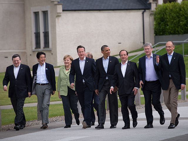 The G8 heads en route to a photo session. They are, from left, European Commission president Jose Manuel Barroso, Prime Minister Shinzo Abe of Japan, Chancellor Angela Merkel of Germany, President Vladimir Putin of Russia, David Cameron, Barack Obama, President Francois Hollande of France, Prime Minister Stephen Harper of Canada, Prime Minister Enrico Letta of Italy.