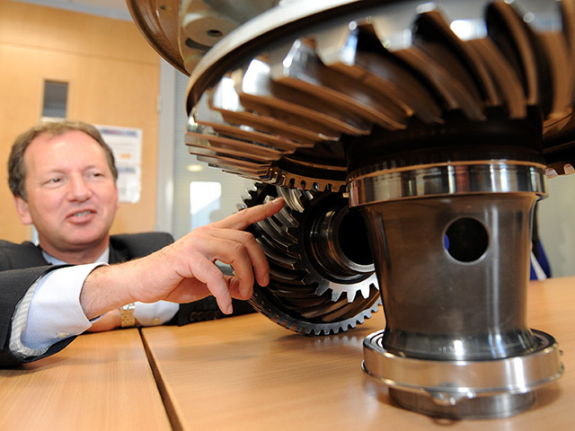 Former Eurocopter CEO Dr Lutz Bertliung with an EC225 shaft and gear box connection.
