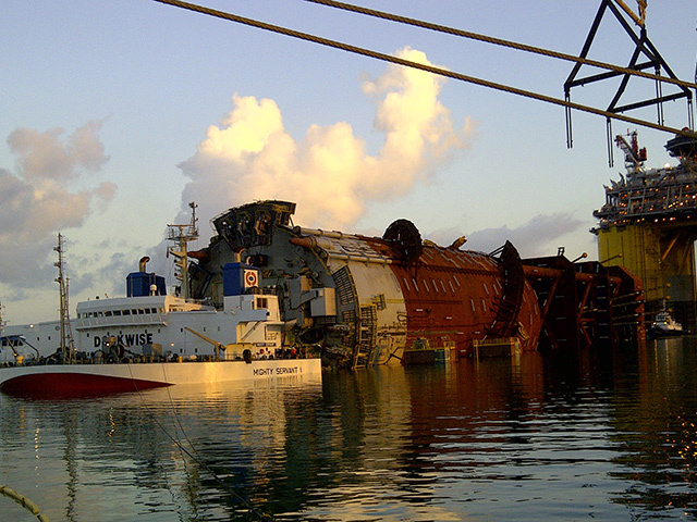 Heavy lift vessel Mighty Servant unloads the 23,000 tonne Lucius production platform spar