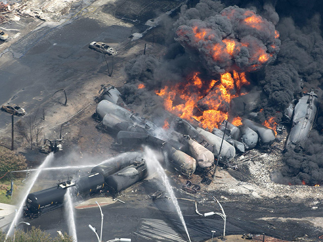 Firefighters continue to battle the burning Lac-Megantic train wreckage