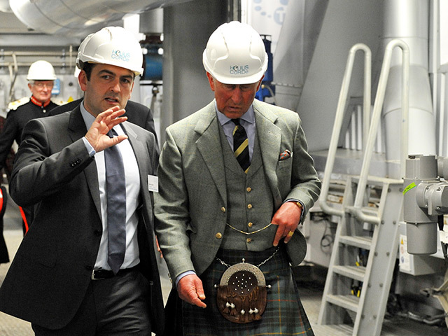 Prince Charles tours the biomass processing plant in July 2013