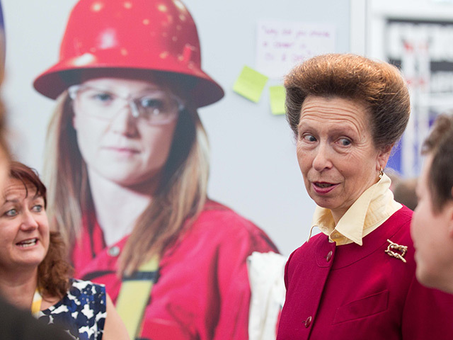 Princess Anne discusses oil and gas industry concerns with women at the Wise stand.