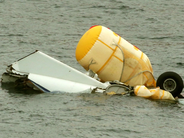 Wreckage of a crashed Super Puma floats in the water off Shetland