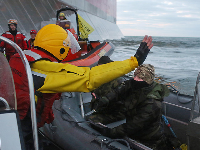 Russian coastguard confront Greenpeace activists at the Prirazlomnaya oil platform. Pic: Denis Sinyakov / Greenpeace