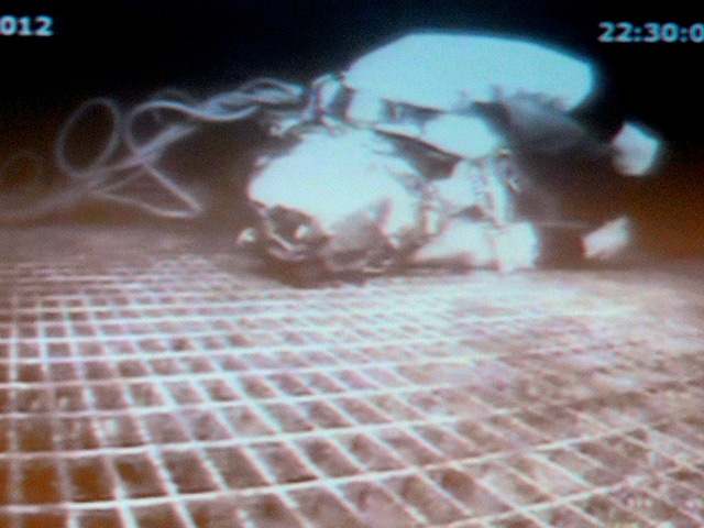 Diver Chris Lemmons lies helpless on the equipment he was working on, 300ft below the surface, after the diver support vessel changed position suddenly