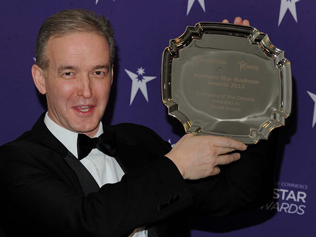 Wood Group UK managing director Robin Watson with the award for company of the decade. Pic: Jim Irvine