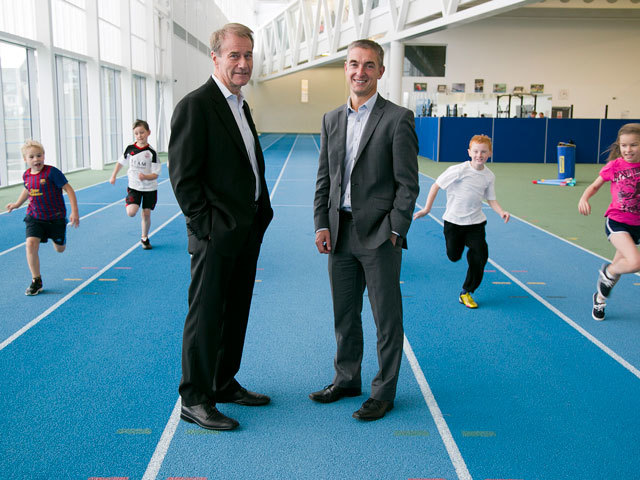 Mike Loggie, CEO of Saltire Energy, and David Beattie, chief executive at Aberdeen Sports Village, with children from Seaton School enjoying athletics at ASV as part of the Saltire Sports for Schools Project