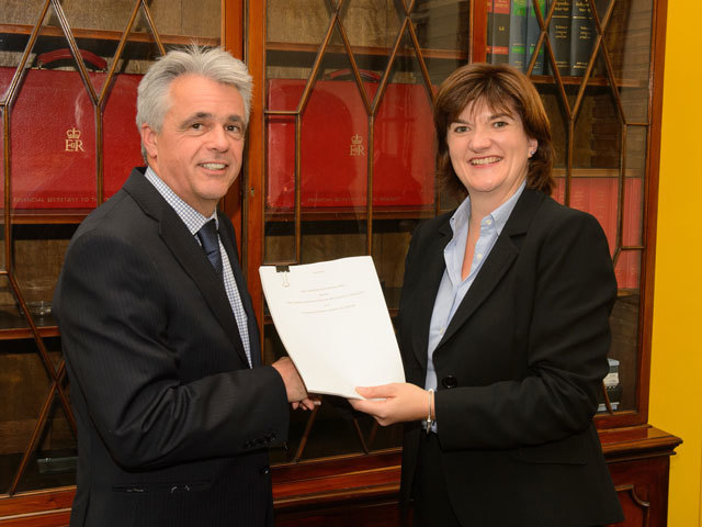 Economic Secretary to the Treasury Nicky Morgan (right) presents a signed decommissioning deed to Robert Anderson, chief financial officer at Talisman Sinopec