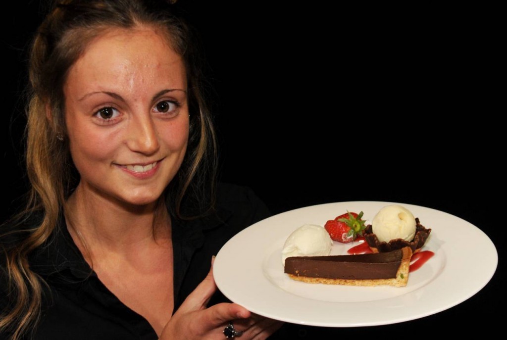 Waitress Sophie Craig with the AECC chocolate deserts.