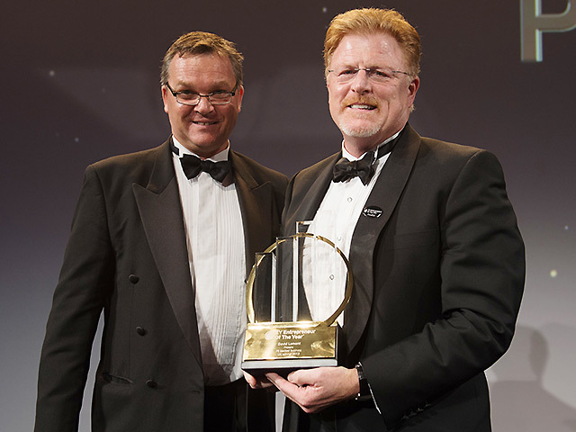 Proserv chief executive David Lamont (right) receives his award from GLL managing director Mark Sesnan.