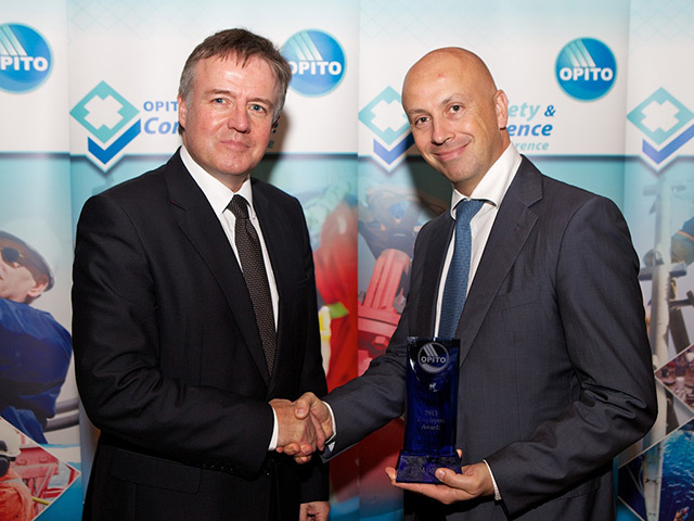 Conference chair Gordon Ballard presents Jean Bernard Poilpre from SBM with the award for OPITO Employer of the Year