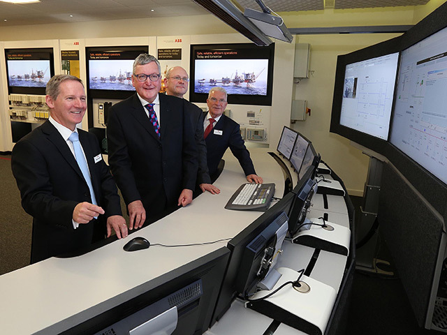 ABB regional service manager Mike Crawford shows Fergus Ewing MSP the offshore control room simulation