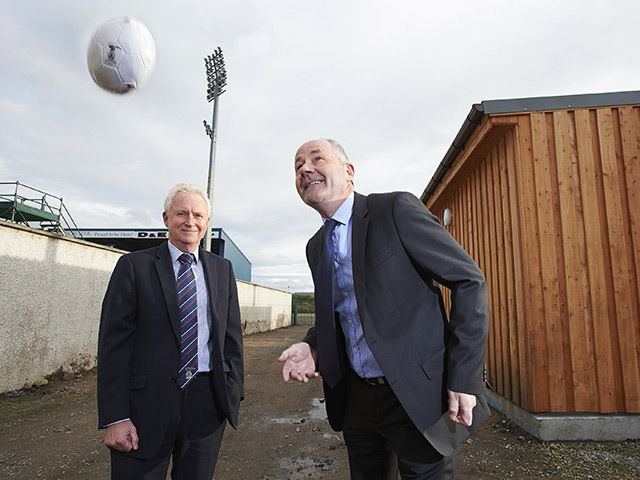 Korrie MD Donnie Fraser, right, with ICTFC chairman Kenny Cameron at the wood-covered biomass cabin
