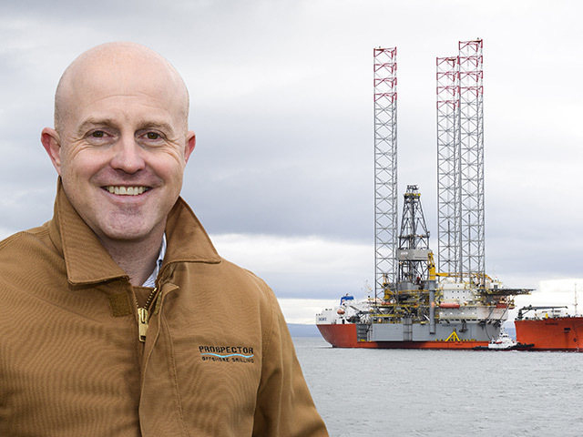 A photo of Chairman of the North Sea Chapter of the IADC Darren Sutherland with the Prospector 1 vessel in the background.