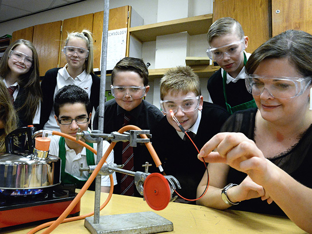 HANDS-ON: Peterhead pupils and teacher Fiona Loudon get to grips with carbon capture experiments