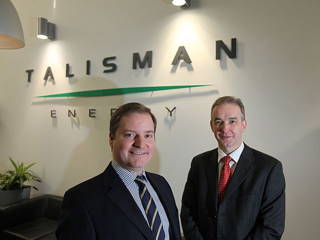 Geoff Holmes (L), Talisman Sinopec Energy UK senior VP with Robin Watson, chief executive of Wood Group PSN