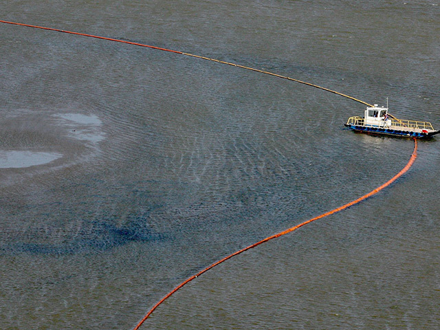 Booms are laid to stop the oil spill after the 2010 Gulf of Mexico disaster
