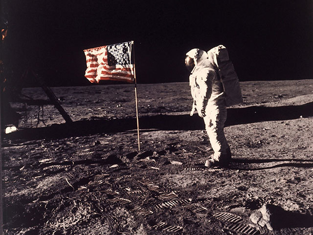 Astronaut ‘Buzz’ Aldrin Jun poses for a photograph beside the US flag deployed on the moon during the Apollo 11 mission on July 20, 1969