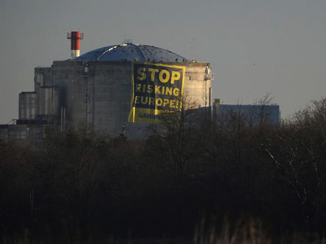 Greenpeace protesters make their presence known at the Fessenheim plant in France