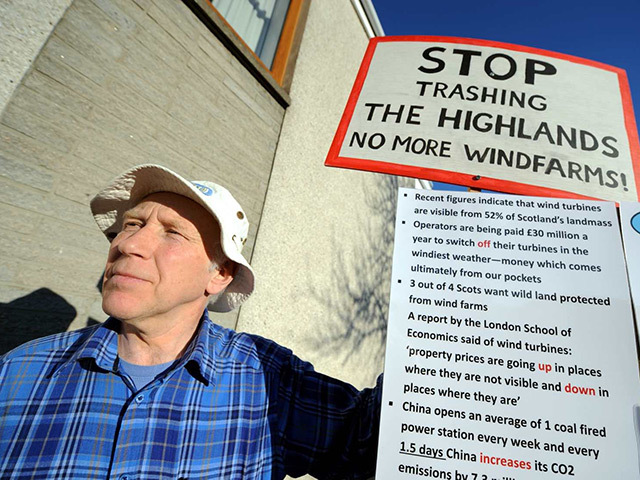 Campaigner George Herraghty protests at the information day for Brown Muir windfarm company near Elgin.