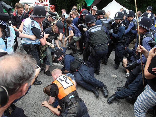 Protesters clash with police at the Balcombe fracking site in August 2013