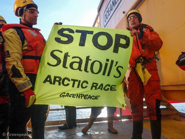 Greenpeace International activists scale and occupy Statoil contracted oil rig Transocean Spitsbergen. Photo by Greenpeace
