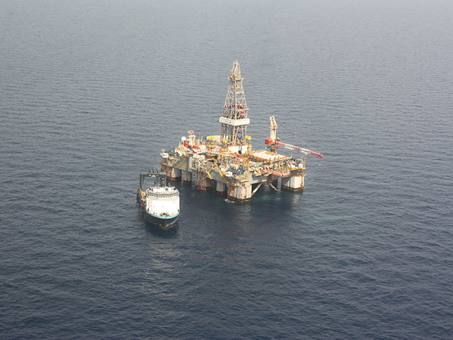 A drilling rig in the middle of the sea