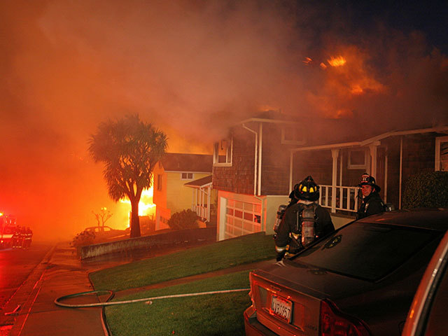 Firemen are seen outside burning homes after an explosion in  San   Bruno , Calif., Thursday, Sept. 9, 2010. Several homes were destroyed as a massive fire roared through a mostly residential neighbourhood in  San   Bruno .
