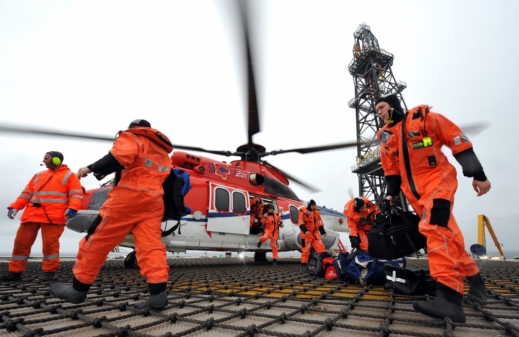 Offshore workers arrive on a platform via a Super Puma helicopter in 2014.