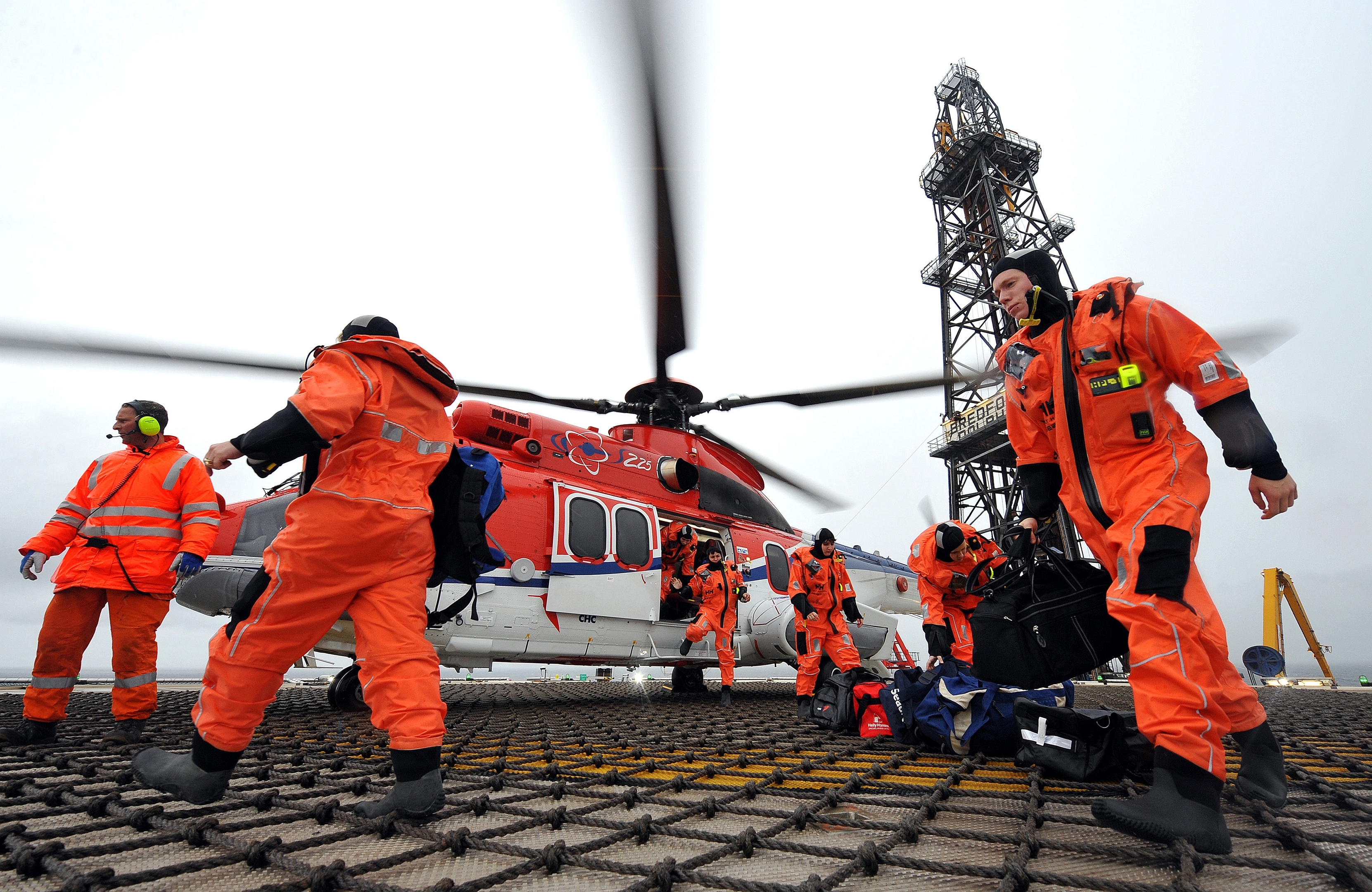 North Sea workers arrive on platform by helicopter