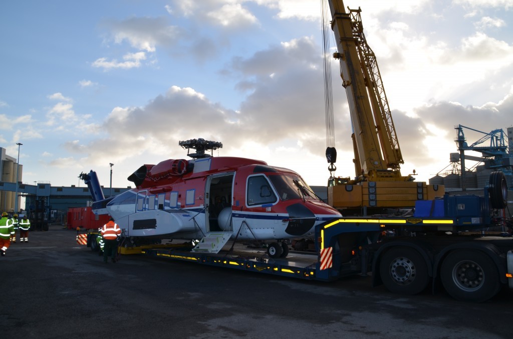 Aircraft is loaded onto a truck - photo by Keith Penman