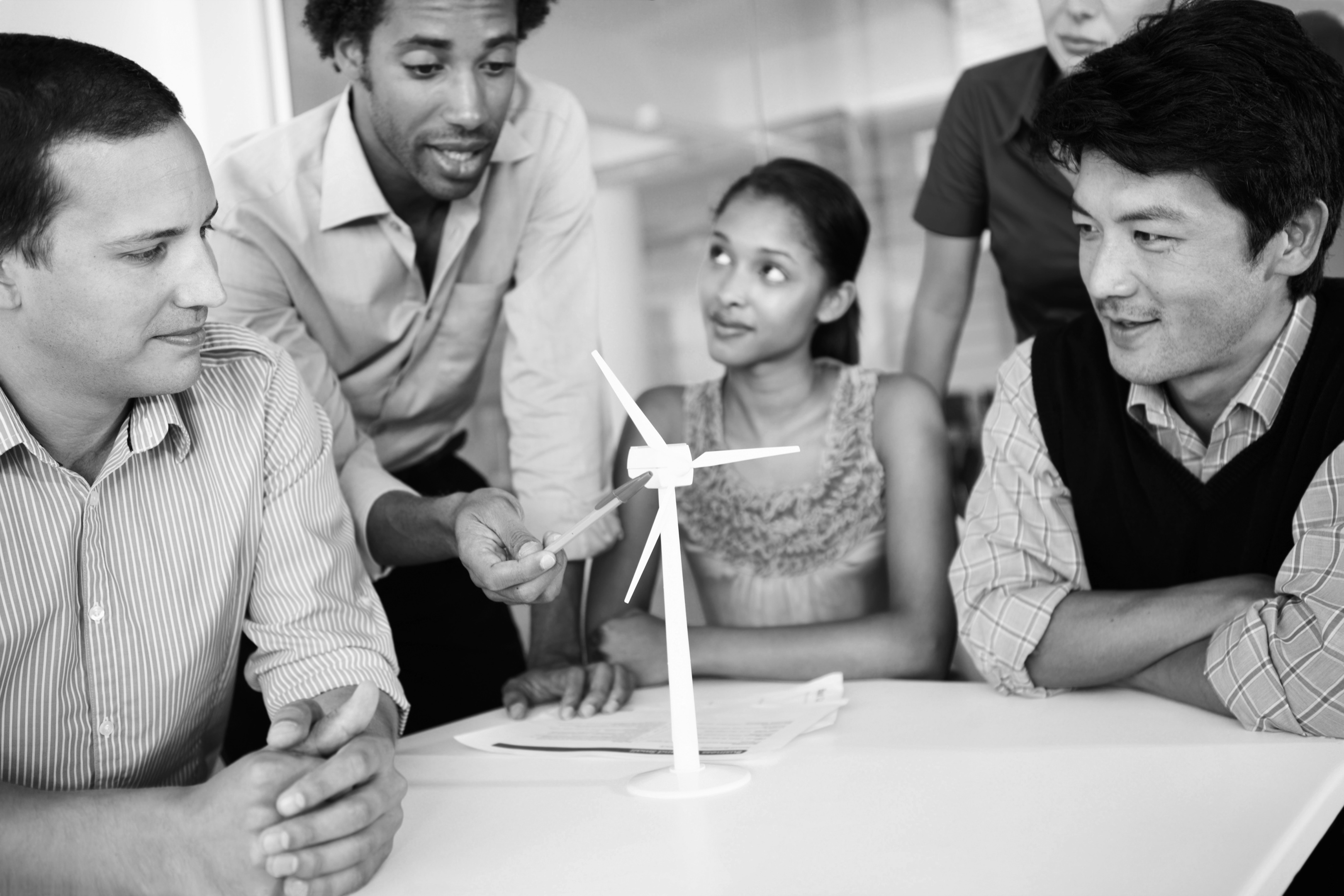 A team of engineers perfecting the design of their wind turbine