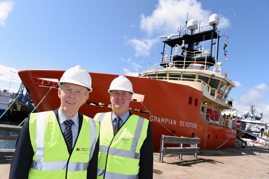 Douglas Craig, Craig Group chairman and managing director, left, and Callum Bruce, managing director of North Star Shipping standing on the quay in front of the Grampian Devotion.