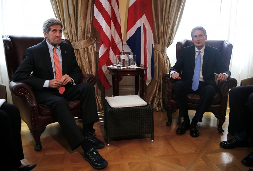U.S. Secretary of State John Kerry, left, meets with British Foreign Secretary Philip Hammond at a hotel where the Iran nuclear talks meetings are being held in Vienna, Austria, Thursday, July 2, 2015