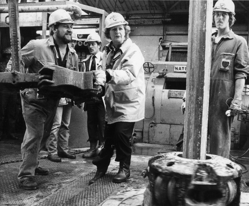 Prime Minister Margaret Thatcher helps toolpusher Colin Murray handle some equipment on the drill floor of Forties Delta in July 1980