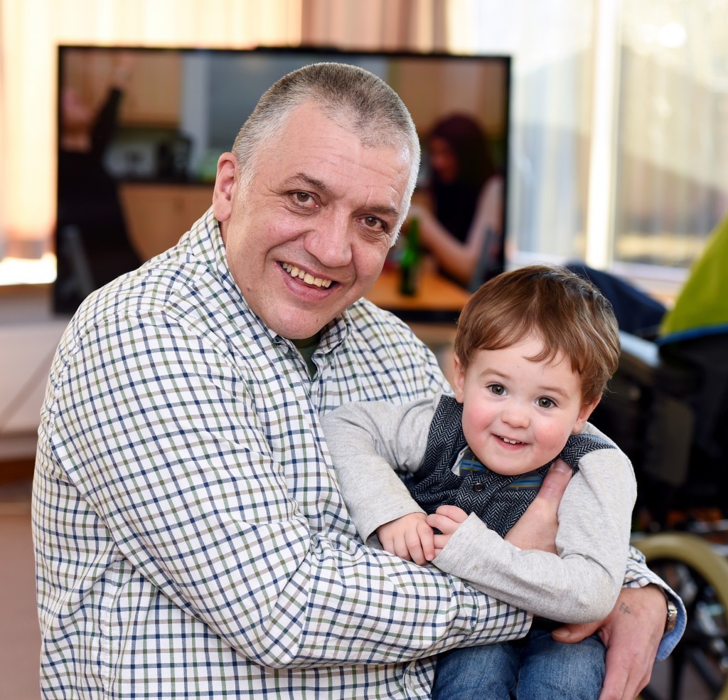 Kenny Harcus who is donating over £1,800 to the Neuro Rehabilitation Ward at Woodend Hospital after he had an accident at work last December and spent three and a half months in the ward. Pictured with his grandson Arlend.