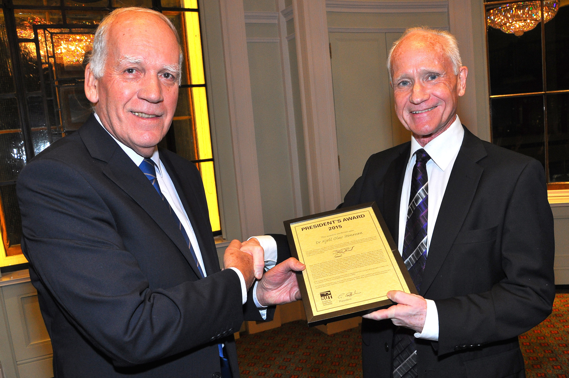 SUT president David Kirkley,  left,  presents,Dr Kjell Olav Stinessen with his award